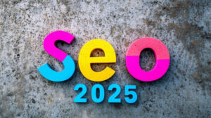 The colorful text «SEO 2025» on a textured concrete background highlights the future of digital strategy.