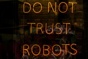 Illuminated sign with the text Do Not Trust Robots